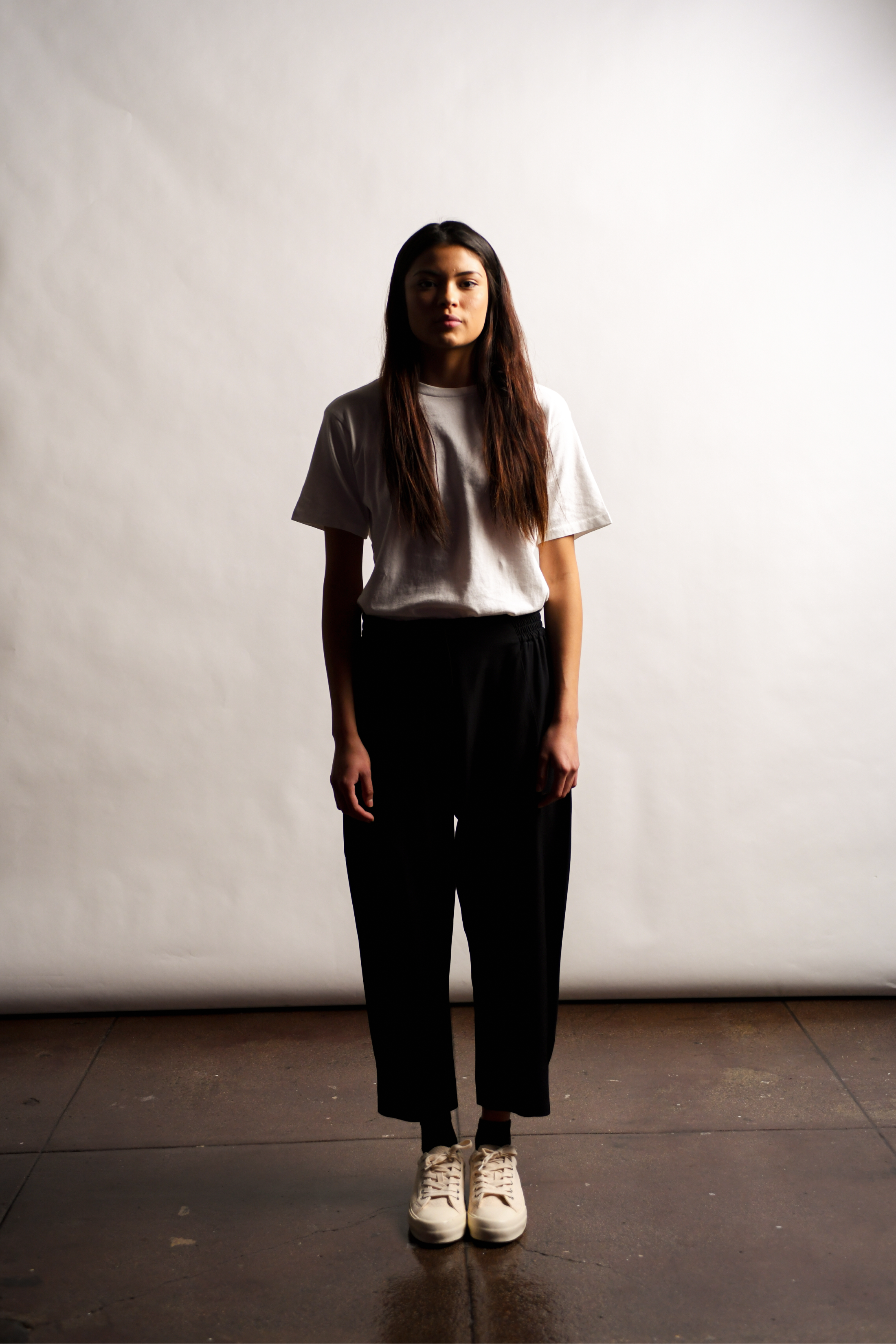 Woman wearing t-shirt and tapered pants